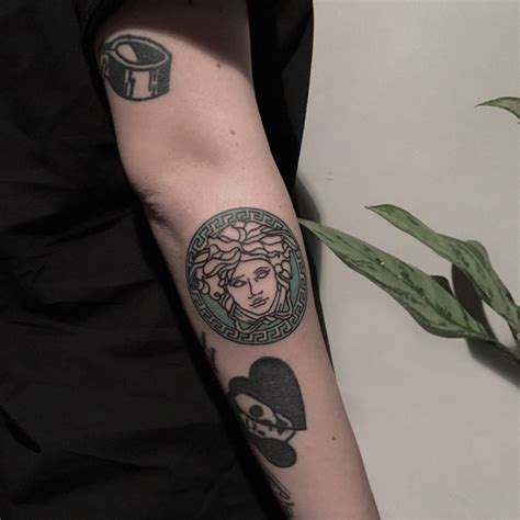 versace logo tattoo.